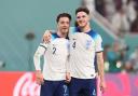 Jack Grealish and Declan Rice celebrate England's win over Iran