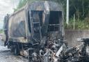 Burnt out lorry that was completely destroyed by a fire on the hard shoulder of the M25 - delays continue.