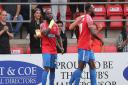 Junior Morias celebrates scoring the second goal for Dagenham & Redbridge against Bromley