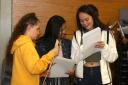 Pupils compare their GCSE results. Picture: Paul Bennett
