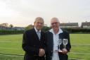 Peter Barham receives the two-wood trophy from Keith Riley