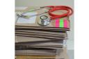 Embargoed to 0001 Wednesday April 12 File photo dated 10/09/13 of a stethoscope on top of patient's files. Around two in every five GPs in one region of England are planning to quit - exposing a potential doctors' crisis in the NHS.