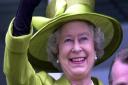 Queen Elizabeth II waves to the crowd at Epsom Downs, 2002