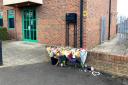 Friends and residents lay flowers where Daniel Laskos, 16, was stabbed to death in Church Road