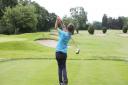 A youngster tees off at Romford Golf Club.