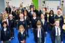 Hogarth Primary School's choir with (back row left to right) headteacher Nera Butcher, music coordinator Hannah Herbert and Geoff Bagwell.