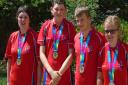 Olly Beadle (second from left) with his gold medal at the Special Olympics in Los Angeles