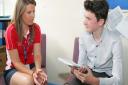 Work experience student Callum Ison interviews Helen Davies, head of PE at Coopers Coborn School,