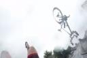 The cyclist and his bike flip over the bonnet. Picture: Youtube