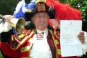 Romford town crier Tony Appleton with the letter of thanks he received from the Duke and Duchess of Cambridge