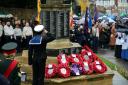 A sea cadet from Hornchurch and Upminster unit salutes at the Hornchurch War Memorial