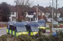 Police vans on Rosewood Avenue in Elm Park today (March 19)