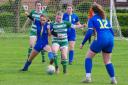 Player of the match Mia Murray challenges for the ball, watched by Darcie Colkett and Lottie Lambert  Image: Bob Knightley