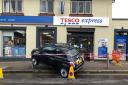 A car was impaled on a pole after a crash outside Tesco Express in Brentwood
