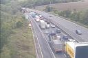 A crash on the M25 between Surrey and Kent has led to long traffic queues and delays of up to 30-minutes with two lanes closed.