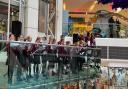 Gidea Park Primary School choir perform at The Mercury shopping centre in Romford.
