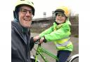 On average Ezra cycles 6.8 miles every day with dad Sean