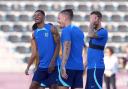 Marcus Rashford shares a joke with England teammates during training at the World Cup