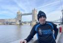 Gary Haines poses by Tower Bridge during his charity quest