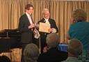 Young cellist Alex Lockyer is presented with the award