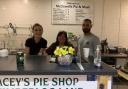 Linda McDowell, centre, the owner of McDowell's Pie & Mash, with staff and Joe (right) a customer of 20 years