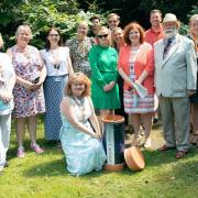 Saint Francis Hospice staff with Havering Mayor Cllr John Mylod before burying the time capsule.
