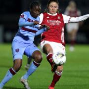 Arsenal's Danielle Van de Donk (right) and West Ham United's Hawa Cissoko battle for the ball during the FA Women's Super League match at Meadow Park, Borehamwood. Picture date: Wednesday April 28, 2021.