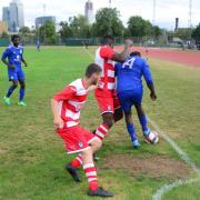 A Sporting Bengal United player looks to keep the ball in the corner against Ilford (pic: Tim Edwards).