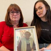 Shirley Everitt (left) and Danielle Everitt (right), with a photograph of Shirley's mother Anne Kelly