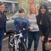 L-R: Samm Cleaver, who donated a bike lock, Charlie Gambleton, Rachel Parrott and Susan Hastings