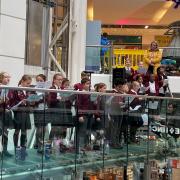 Gidea Park Primary School choir perform at The Mercury shopping centre in Romford.