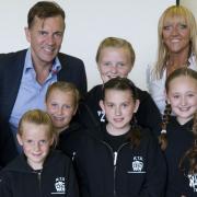Dragon Duncan Bannatyne from Dragons' Den with Razzamataz founder Denise Hutton-Gosney and her pupils.