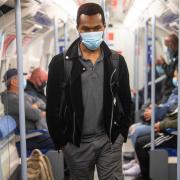 Passengers wearing face masks on the Jubilee Line in East London