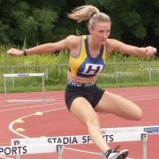Flic Clarke on her way to 400m hurdles victory