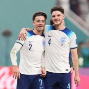 Jack Grealish and Declan Rice celebrate England's win over Iran