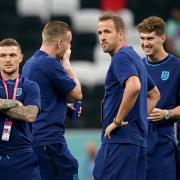 Kieran Trippier and Harry Kane look on before one of England's games at the World Cup