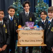 Students at the Royal Liberty School with one of the festive hampers they sent out to members of their community struggling with the cost-of-living crisis