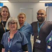 Members of the vaccination team at King George Hospital. (L-R) Operational manager Karena Roberts, Taz Milbank, senior clinical lead for vaccinations, retired nurses Margo McFarlane and Hazel Moore, pharmacist Atil Patel and admin worker Jane Masterson