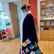King Charles coronation cape in Havering Museum's foyer. Image credit: Havering Museum