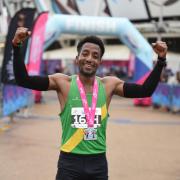 A runner celebrates after last year's London Half and 10k at the Queen Elizabeth Olympic Park.