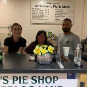 Linda McDowell, centre, the owner of McDowell's Pie & Mash, with staff and Joe (right) a customer of 20 years