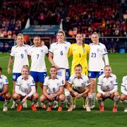 England line up before their game against China