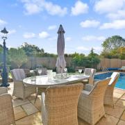 The house in Bournebridge Lane has two reception rooms, four bedrooms, and its very own swimming pool