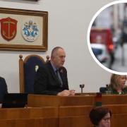 Council leader Ray Morgon's (centre) cabinet has rowed back on car parking charge plans