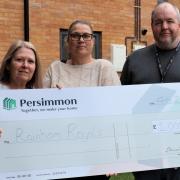 Rainham Royals' Paula Young and Sam Sheena with Cllr Matt Stanton receiving the cheque