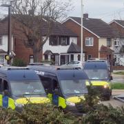 Police vans on Rosewood Avenue in Elm Park today (March 19)