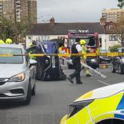 A flipped car in Harold Hill prompted emergency services to rush to the scene