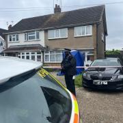 Police outside a home in Cornwall Close, Hornchurch