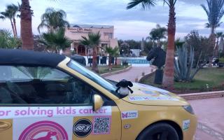 Michael Hook completed his drive from Hornchurch to Marrakesh in a convertible yellow Saab decorated with memorabilia associated with his daughter