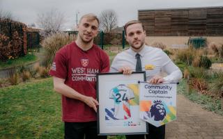 Callum Oubridge presented with the 2024 Community Captain award by West Ham star Jarrod Bowen